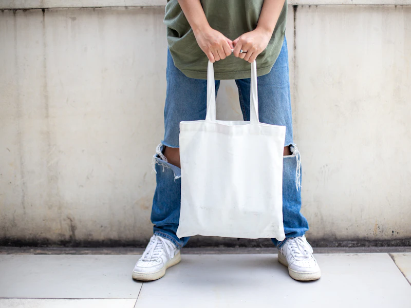Plain cotton tote bag held ready for retail branding