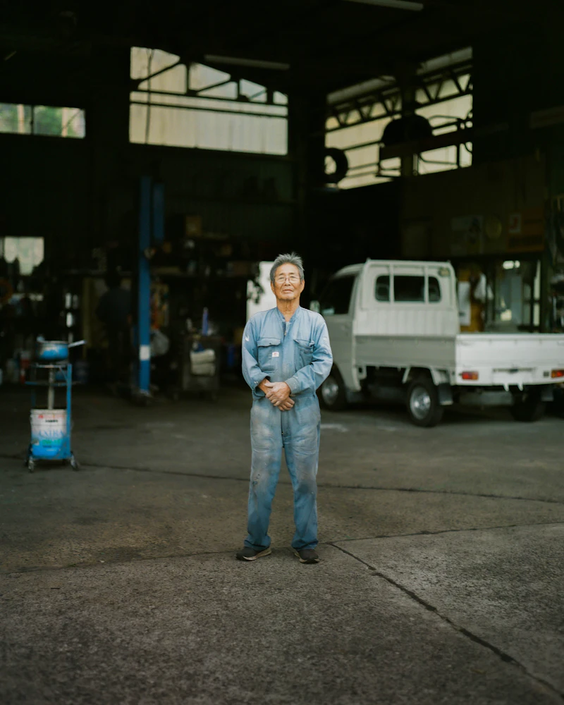 Worker wearing custom industrial coveralls manufactured for daily use